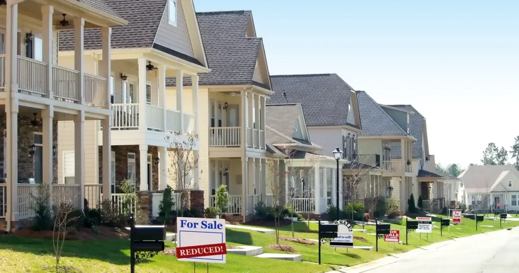 Houses with "For Sale" signs